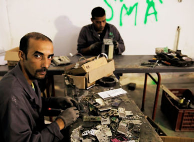 Men working at the Collectun-D3E-Recyclage plant in Tunisia
